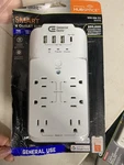 Commercial Electric 6-OUTLET Smart Surge Protector With 4-USB Ports, White. Fixed Price $15.00.