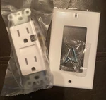 One White Outlet Receptacle With Night Light Wall 15 Amp 125VOLT. Fixed Price $15.00.