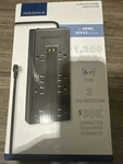 Insignia- 8-OUTLET 1,200 Joules Surge Protector Black. Fixed Price $12.99.