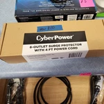 Cyberpower CSP604T Professional Surge Protector, 1350J/125V, Outlets, 4FT Cord. Fixed Price $10.00.