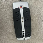 Power Strip- 10-OUTLET Surge Protector W/ Phone, Network, Coaxial Protection. Fixed Price $16.99.