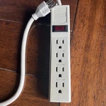 4 Outlet Surge Protector/ Staples 35 Cord. Fixed Price $15.00.