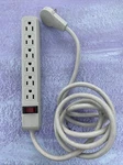 6-OUTLET Surge Protector Strip Grey. Fixed Price $8.50.