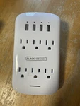 Black+decker White 6 Grounded Outlets Surge Protector With 4 Usb Charging Ports. Fixed Price $12.99.
