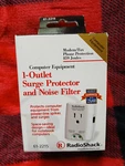 Tandy Radio Shack 1-OUTLET Surge Protector Noise Filter 859J 61-2215. Fixed Price $10.00.