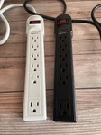Amazonbasics 6 Outlet Surge Protector Power Cord - Black And White 2 Pack. Fixed Price $5.63.