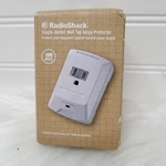 Radioshack Single Outlet Wall Tap Surge Protector, 900 Joule, White 6100429. Fixed Price $12.15.